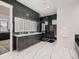 Elegant bathroom with marble walls, tiled floors, a dual vanity, and a walk-in shower at 29780 E 162Nd Ave, Brighton, CO 80603