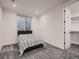 This bedroom features a window, carpeted floors, and an attached closet at 29780 E 162Nd Ave, Brighton, CO 80603