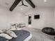 Spacious bedroom with vaulted ceilings and barn door entrance to a bathroom for added privacy at 29780 E 162Nd Ave, Brighton, CO 80603