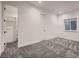 Spacious bedroom with plush gray carpeting, window with blinds, and a closet at 29780 E 162Nd Ave, Brighton, CO 80603
