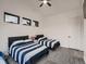 Cozy bedroom with two beds, a ceiling fan, and a window with a view at 29780 E 162Nd Ave, Brighton, CO 80603
