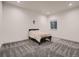 Minimalist bedroom with neutral carpet, one window, and a simple bed frame at 29780 E 162Nd Ave, Brighton, CO 80603