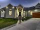 Beautiful exterior of a well-lit modern home with a walkway leading to the front door and stylish garage at 29780 E 162Nd Ave, Brighton, CO 80603