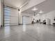 This garage includes plenty of space for storage or vehicles, and a staircase leading to an upper level at 29780 E 162Nd Ave, Brighton, CO 80603