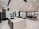 Open-concept kitchen flows into the dining area with views of the outdoors and a large island at 29780 E 162Nd Ave, Brighton, CO 80603