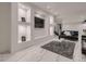 This open living space features unique wall cutouts and a sleek white marble floor at 29780 E 162Nd Ave, Brighton, CO 80603
