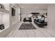 Open living room featuring modern furnishings, including couches and a sleek marble floor at 29780 E 162Nd Ave, Brighton, CO 80603