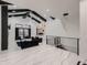 Spacious living room boasting high ceilings with dark wood beams, modern chandeliers, and elegant marble floors at 29780 E 162Nd Ave, Brighton, CO 80603