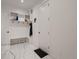 This mudroom includes tile floors, a bench, and coat rack at 29780 E 162Nd Ave, Brighton, CO 80603