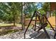 Private backyard with an outdoor swing and shady aspen trees at 85 Revett Dr # 15, Breckenridge, CO 80424
