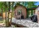 Private backyard with an outdoor swing and shady aspen trees at 85 Revett Dr # 15, Breckenridge, CO 80424