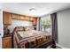 Cozy bedroom with paneled walls and built in storage above the bed at 85 Revett Dr # 15, Breckenridge, CO 80424