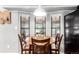 Charming dining area with a round wooden table and chairs, perfect for intimate meals and gatherings at 85 Revett Dr # 15, Breckenridge, CO 80424