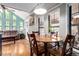 Cozy dining area with round wooden table and chairs, adjacent to living room, perfect for Gathering meals at 85 Revett Dr # 15, Breckenridge, CO 80424