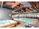 Community indoor pool and hot tub with a vaulted ceiling, providing recreation year-round at 85 Revett Dr # 15, Breckenridge, CO 80424