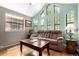 Cozy living room bathed in natural light, featuring comfortable seating and a warm ambiance at 85 Revett Dr # 15, Breckenridge, CO 80424