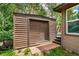 A wood shed sits next to the steps of a wood clad home at 85 Revett Dr # 15, Breckenridge, CO 80424