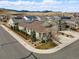 A beautiful suburban home with a landscaped yard, inviting curb appeal, and convenient driveway parking at 6013 Eldora St, Golden, CO 80403