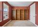 Cozy room with a large window, tan carpet and a floor to ceiling bookcase at 6013 Eldora St, Golden, CO 80403