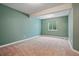 Spacious bedroom with neutral carpet and a window providing natural light at 6013 Eldora St, Golden, CO 80403