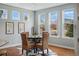 Cozy breakfast nook with a round table, wicker chairs, and bright natural lighting at 6013 Eldora St, Golden, CO 80403