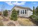Charming single-Gathering home featuring a well-maintained lawn and cozy front porch, perfect for relaxing outdoors at 6013 Eldora St, Golden, CO 80403