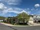 Charming house featuring a two-car garage, beautiful landscaping, and mountain views at 6013 Eldora St, Golden, CO 80403