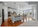 Bright, modern kitchen features an island with seating and stainless steel appliances at 6013 Eldora St, Golden, CO 80403