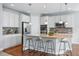Beautiful kitchen with white cabinets, stainless steel appliances, and a large island with seating at 6013 Eldora St, Golden, CO 80403