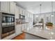 Kitchen featuring stainless steel appliances, modern countertops, and ample cabinet space at 6013 Eldora St, Golden, CO 80403