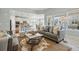 Open-concept living room with large windows offering plenty of natural light and mountain views at 6013 Eldora St, Golden, CO 80403
