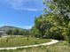 Explore a serene park with a walking path, recreational sports, and lush greenery for outdoor enjoyment at 6013 Eldora St, Golden, CO 80403
