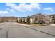 Street view of a lovely home with charming curb appeal and a well-kept yard at 6013 Eldora St, Golden, CO 80403