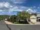 Charming corner lot home with well-maintained landscaping and a welcoming facade on a sunny day at 6013 Eldora St, Golden, CO 80403
