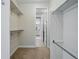 Walk-in closet with ample shelving and hanging space, leading to the ensuite bathroom at 6013 Eldora St, Golden, CO 80403