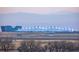 An airport in the distance with mountains in the background at 20535 E 47Th Ave, Denver, CO 80249