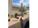 A cozy backyard featuring a brick patio, lounge chairs, and a shade umbrella at 20535 E 47Th Ave, Denver, CO 80249