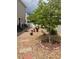 A brick patio and stone garden create a relaxing backyard oasis at 20535 E 47Th Ave, Denver, CO 80249