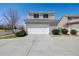 Home featuring a large two-car garage and long driveway in a desirable neighborhood at 20535 E 47Th Ave, Denver, CO 80249