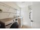 Clean laundry room with modern washer and dryer, shelving and ample space for storage at 20535 E 47Th Ave, Denver, CO 80249