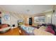 Comfortable living room with hardwood floors, cozy furniture, and staircase access at 20535 E 47Th Ave, Denver, CO 80249