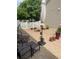 A quaint patio with an umbrella, patio set and stone benches at 20535 E 47Th Ave, Denver, CO 80249
