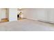 Spacious living room leading to a tiled kitchen space at 585 S Alton Way # 6B, Denver, CO 80247