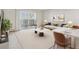 A cozy living room featuring a sliding glass door to a balcony and elegant decor at 585 S Alton Way # 6B, Denver, CO 80247
