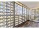 Sunroom with glass block windows and wood flooring at 585 S Alton Way # 6B, Denver, CO 80247
