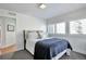 Cozy bedroom with a comfortable bed, plush pillows, and a window with plantation shutters at 4514 W 34Th Ave, Denver, CO 80212