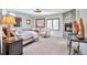 Comfortable bedroom boasting a stone fireplace, soft lighting, and neutral decor at 4514 W 34Th Ave, Denver, CO 80212