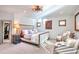 Bright primary bedroom featuring plush carpeting, stylish decor, and ample natural light at 4514 W 34Th Ave, Denver, CO 80212