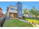 Contemporary home showcasing a well-maintained front yard and modern architectural details at 4514 W 34Th Ave, Denver, CO 80212