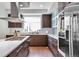 Modern kitchen with stainless steel appliances, sleek countertops, and wood cabinets at 4514 W 34Th Ave, Denver, CO 80212
